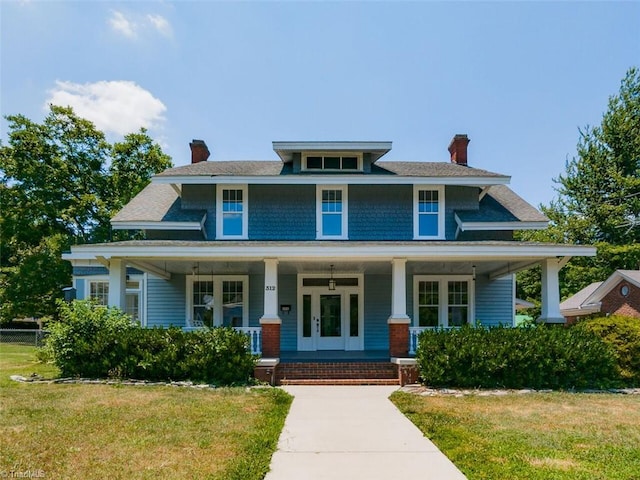 view of front of home with a front lawn