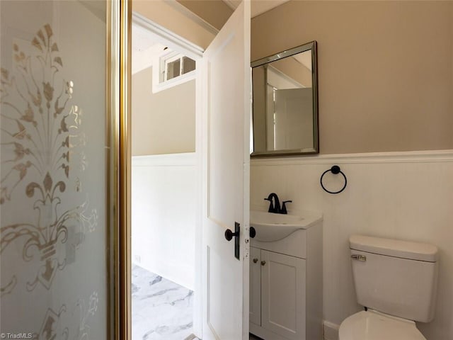 bathroom with vanity and toilet