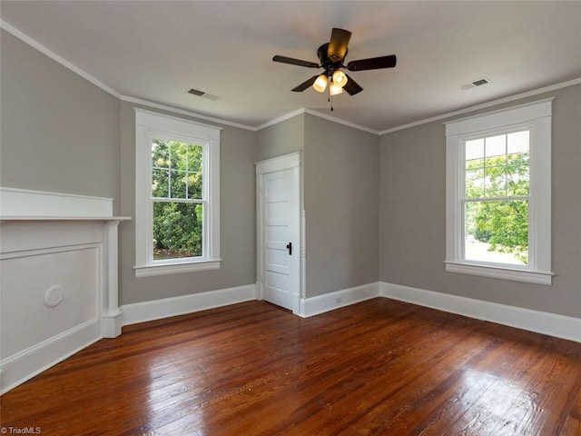 spare room with ceiling fan, dark hardwood / wood-style flooring, and crown molding