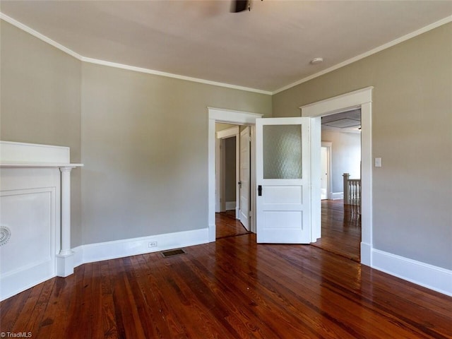 unfurnished living room featuring hardwood / wood-style floors and crown molding