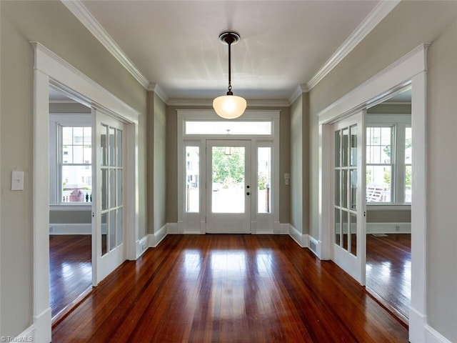 foyer with a healthy amount of sunlight, dark hardwood / wood-style flooring, and french doors