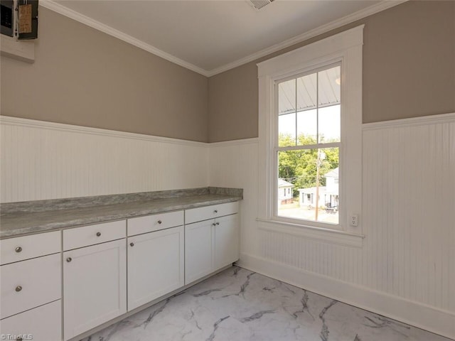 laundry room featuring crown molding