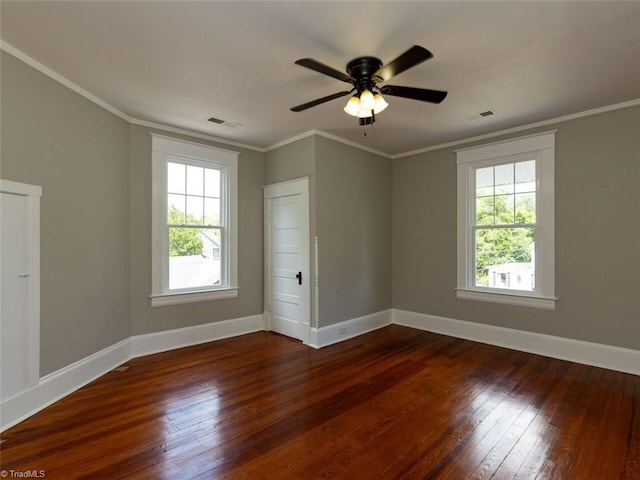 spare room with dark hardwood / wood-style floors, ceiling fan, and crown molding