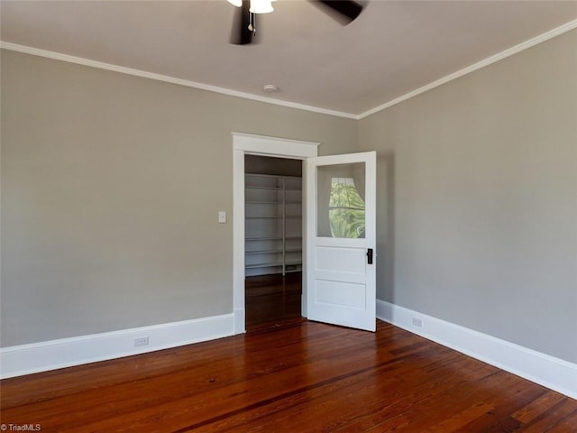 unfurnished room featuring dark hardwood / wood-style flooring, ceiling fan, and ornamental molding