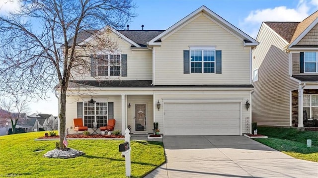 traditional-style home featuring driveway, an attached garage, and a front lawn