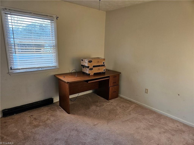 office area featuring light carpet