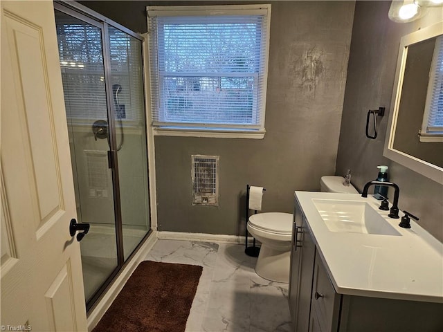 bathroom featuring an enclosed shower, vanity, and toilet