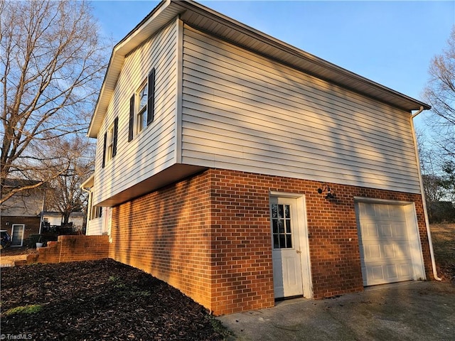 view of property exterior featuring a garage