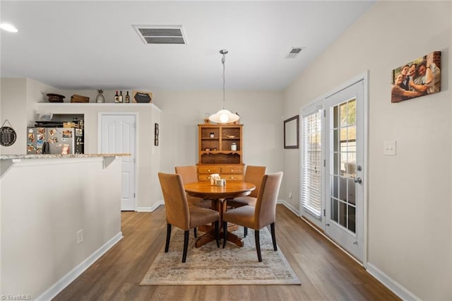 dining area featuring dark hardwood / wood-style flooring