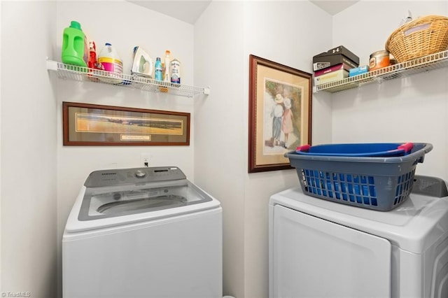 laundry area featuring washing machine and clothes dryer