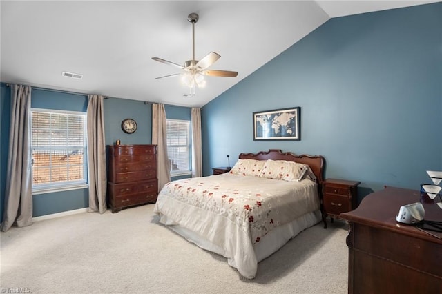 bedroom featuring ceiling fan, light carpet, and vaulted ceiling