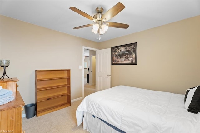 bedroom featuring light colored carpet and ceiling fan