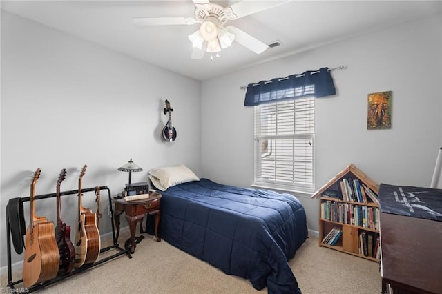 bedroom featuring ceiling fan and carpet floors