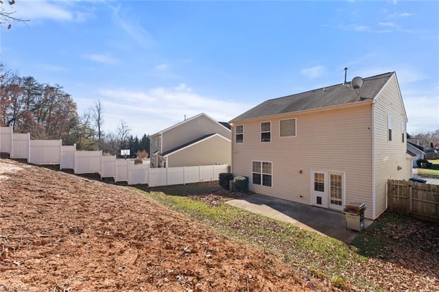 back of property featuring a patio and french doors