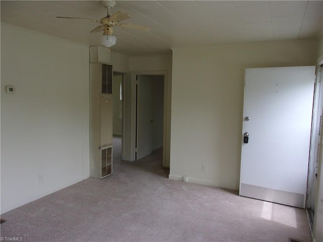 unfurnished bedroom with ceiling fan and light carpet