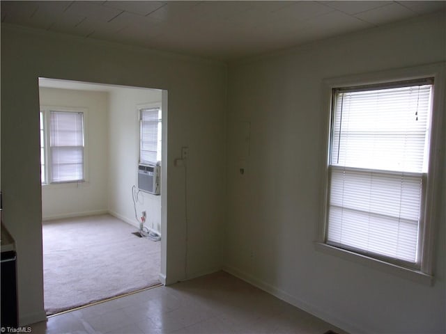 unfurnished room with light tile flooring