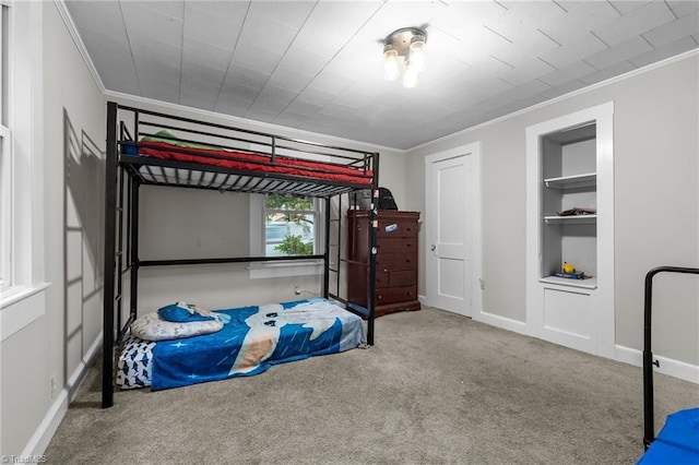 1105 Hawthorne Ln, Burlington, NC 27215 - carpeted bedroom with ornamental molding and baseboards