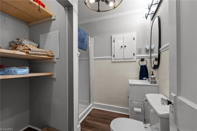 1105 Hawthorne Ln, Burlington, NC 27215 - full bath with a shower stall, toilet, wood finished floors, crown molding, and a sink