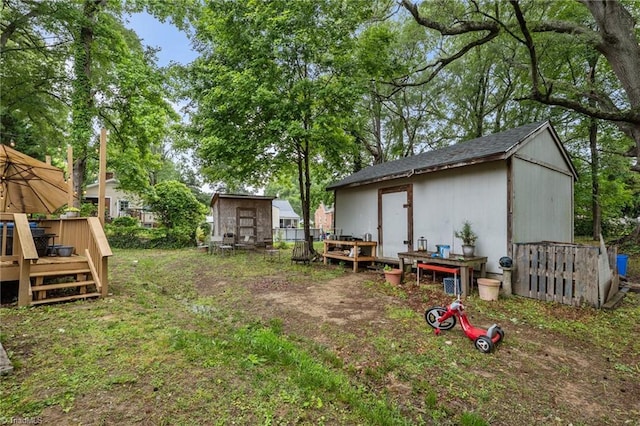 1105 Hawthorne Ln, Burlington, NC 27215 - view of yard with a wooden deck