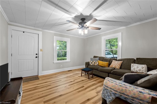 1105 Hawthorne Ln, Burlington, NC 27215 - living room with light wood finished floors, crown molding, a ceiling fan, and baseboards