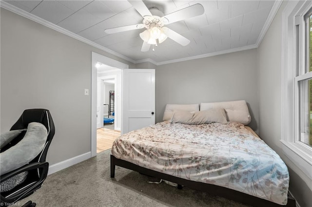 1105 Hawthorne Ln, Burlington, NC 27215 - bedroom featuring carpet floors, baseboards, crown molding, a ceiling fan, and multiple windows