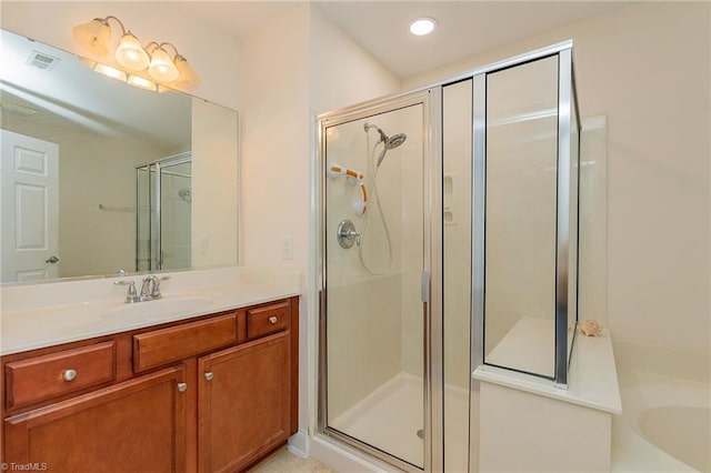 full bath featuring visible vents, a stall shower, and vanity