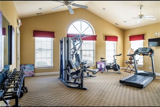 exercise room featuring carpet floors, a ceiling fan, and vaulted ceiling