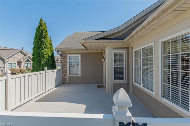 view of patio featuring fence