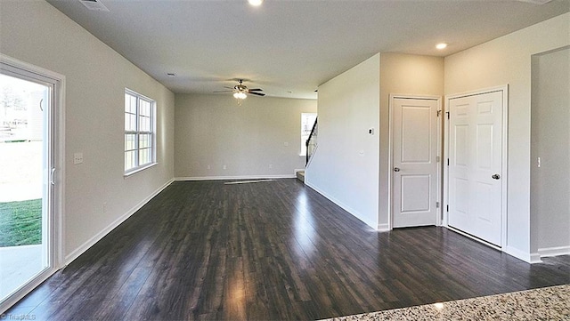 empty room featuring dark hardwood / wood-style flooring and ceiling fan