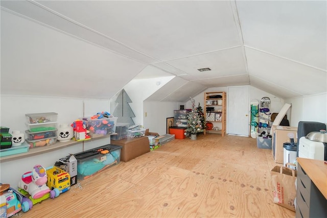 additional living space featuring vaulted ceiling