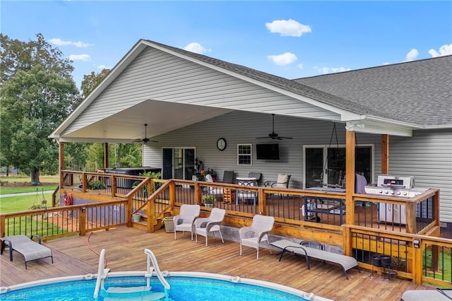 back of property featuring a swimming pool side deck and ceiling fan