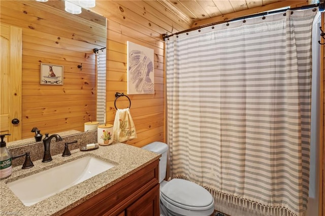 bathroom with curtained shower, toilet, wooden ceiling, wooden walls, and vanity