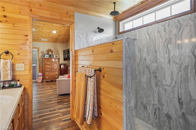 bathroom featuring vanity, wood ceiling, and a shower