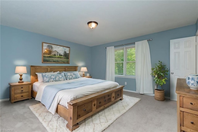 bedroom with carpet floors and baseboards