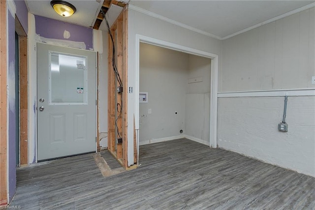 clothes washing area with crown molding, hookup for a washing machine, and wood finished floors