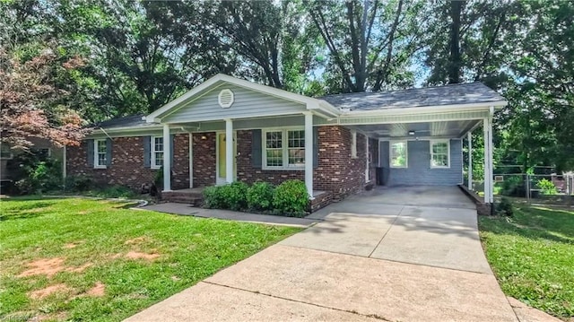368 Shady Grove Rd, Eden, NC 27288 - ranch-style house featuring a front lawn, driveway, a carport, and brick siding