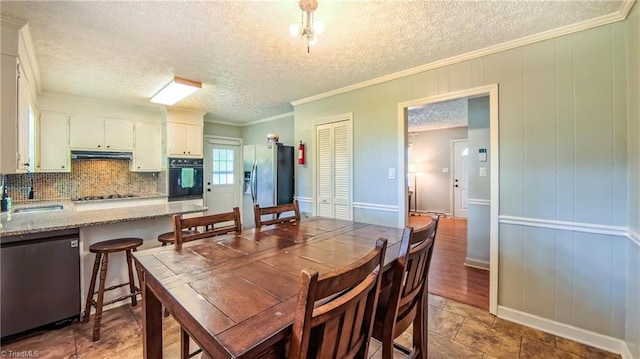 368 Shady Grove Rd, Eden, NC 27288 - dining room with a textured ceiling and ornamental molding