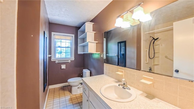 368 Shady Grove Rd, Eden, NC 27288 - bathroom with a shower, vanity, a textured ceiling, tasteful backsplash, and tile patterned floors