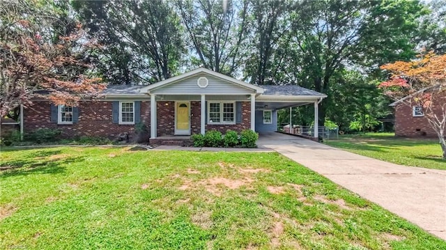 368 Shady Grove Rd, Eden, NC 27288 - view of front facade with a carport, a front yard, driveway, and brick siding