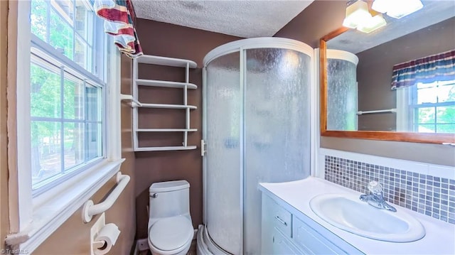 368 Shady Grove Rd, Eden, NC 27288 - full bath featuring a shower stall, vanity, backsplash, and a textured ceiling