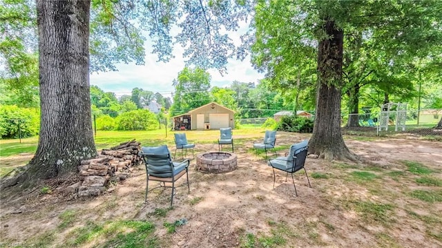 368 Shady Grove Rd, Eden, NC 27288 - view of yard featuring a fire pit and an outbuilding