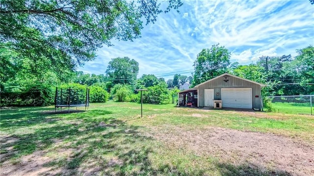 368 Shady Grove Rd, Eden, NC 27288 - view of yard featuring a trampoline, a detached garage, and an outdoor structure
