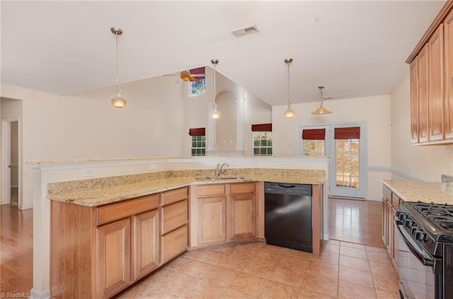 kitchen featuring light stone counters, gas range, sink, decorative light fixtures, and black dishwasher