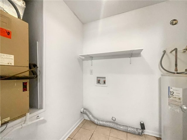 clothes washing area featuring hookup for an electric dryer, light tile patterned floors, hookup for a washing machine, and water heater