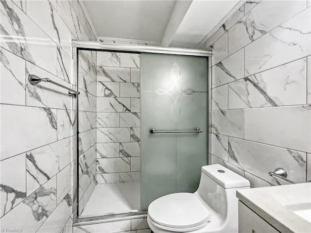 bathroom with vanity, toilet, and a shower with shower door