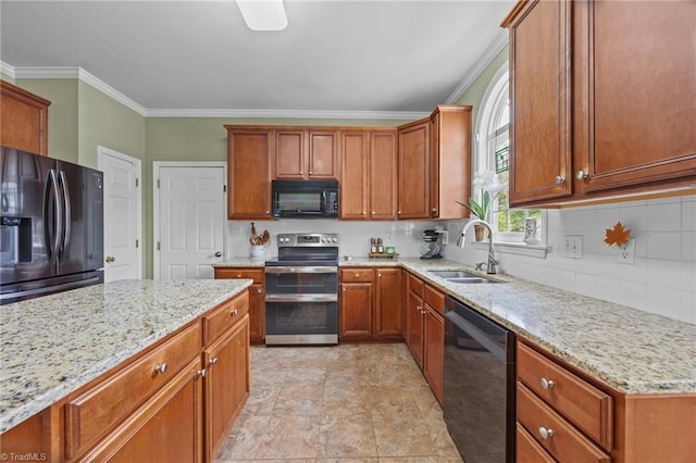 168 Redmeadow Dr, Advance, NC 27006 - kitchen with black appliances, crown molding, light stone counters, backsplash, and brown cabinetry