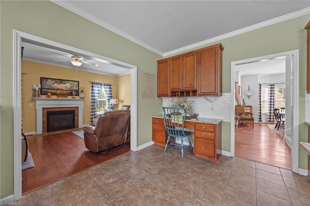 168 Redmeadow Dr, Advance, NC 27006 - tiled office featuring ornamental molding, plenty of natural light, a fireplace, and a ceiling fan
