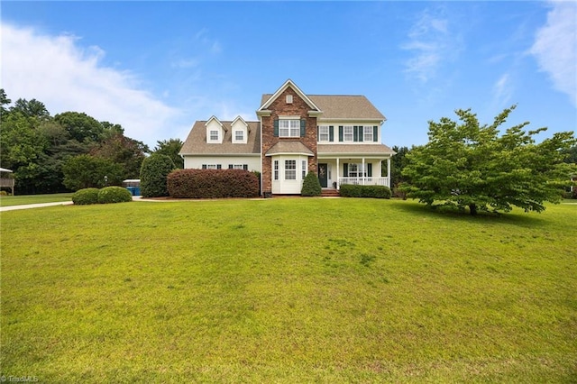 168 Redmeadow Dr, Advance, NC 27006 - view of front facade featuring covered porch and a front lawn
