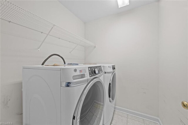 168 Redmeadow Dr, Advance, NC 27006 - washroom with baseboards and washing machine and dryer