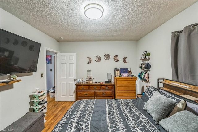 3121 Luther St, Winston-Salem, NC 27127 - bedroom featuring a textured ceiling and wood finished floors